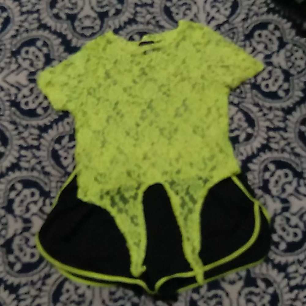 A see through neon green top and matching shorts